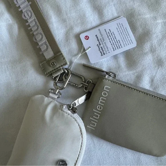 12 🆕 Lululemon Dual Pouch Wristlet Wordmark Raw Linen White Opal